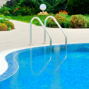 Swimming pool with stair at hotel close up